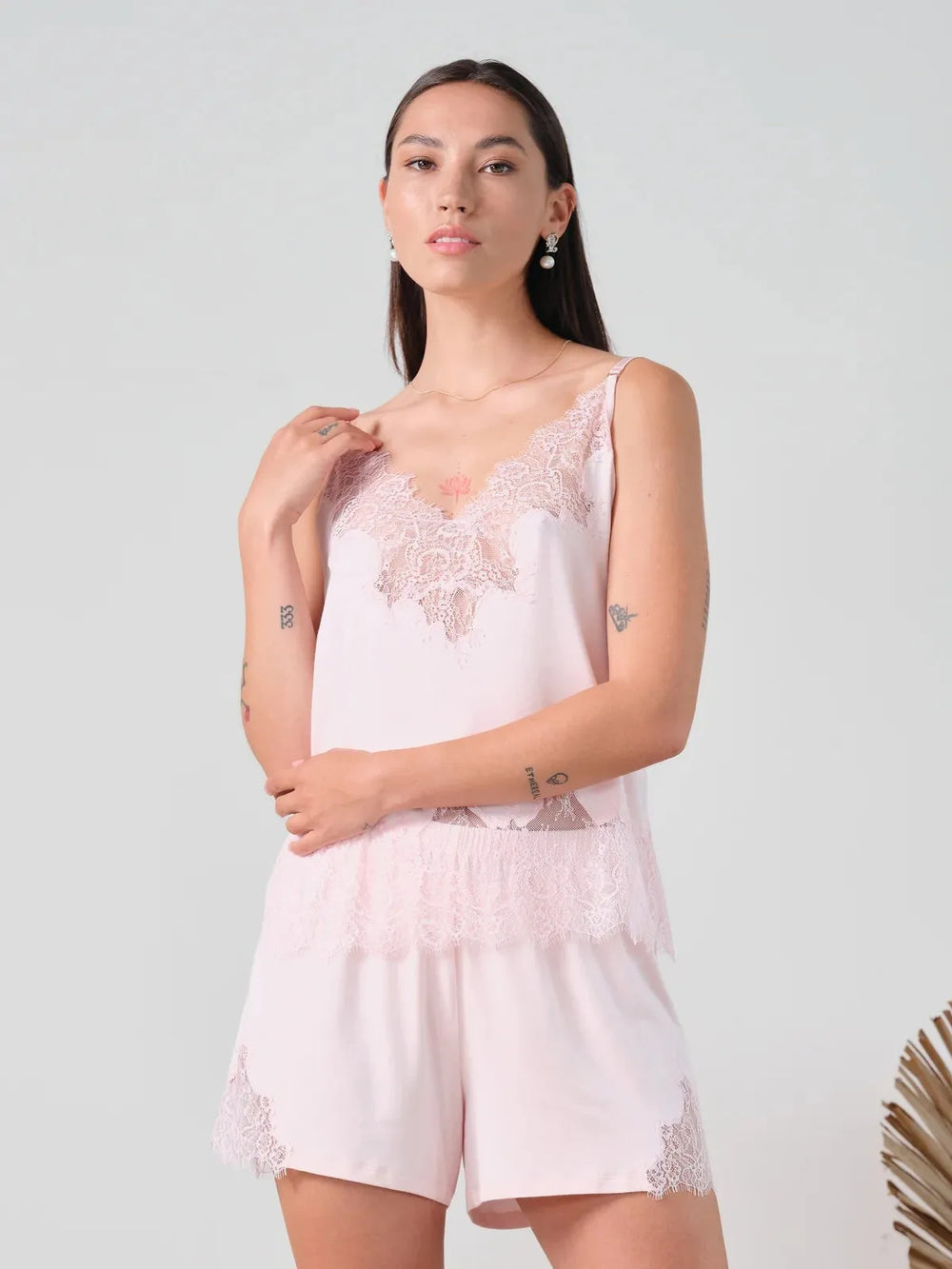 Model wearing an Effetto pink bamboo camisole and shorts