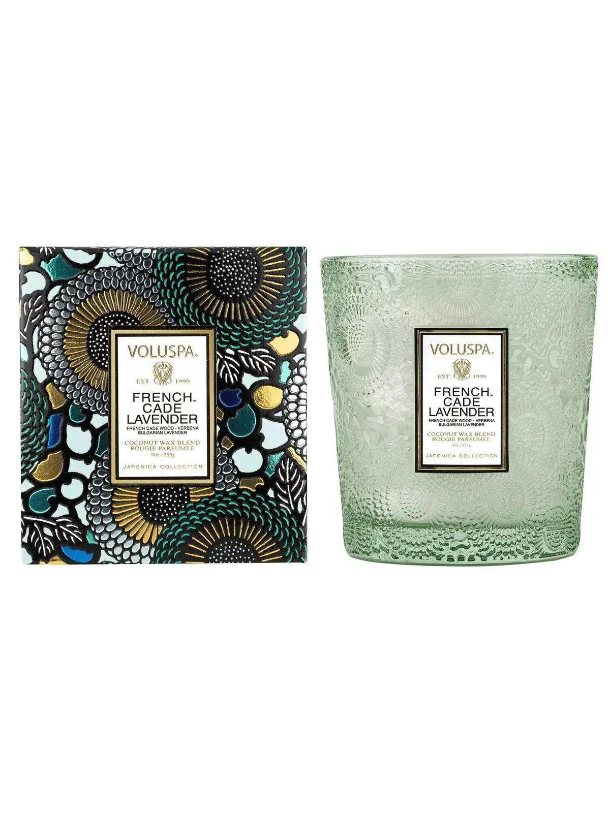 Voluspa French Cade Lavender Classic Candle, pale green glass candle beside a patterned box