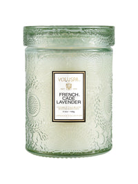 Voluspa French Cade Lavender Small Jar Candle, 5.5 oz, pale green embossed glass jar with the lid on