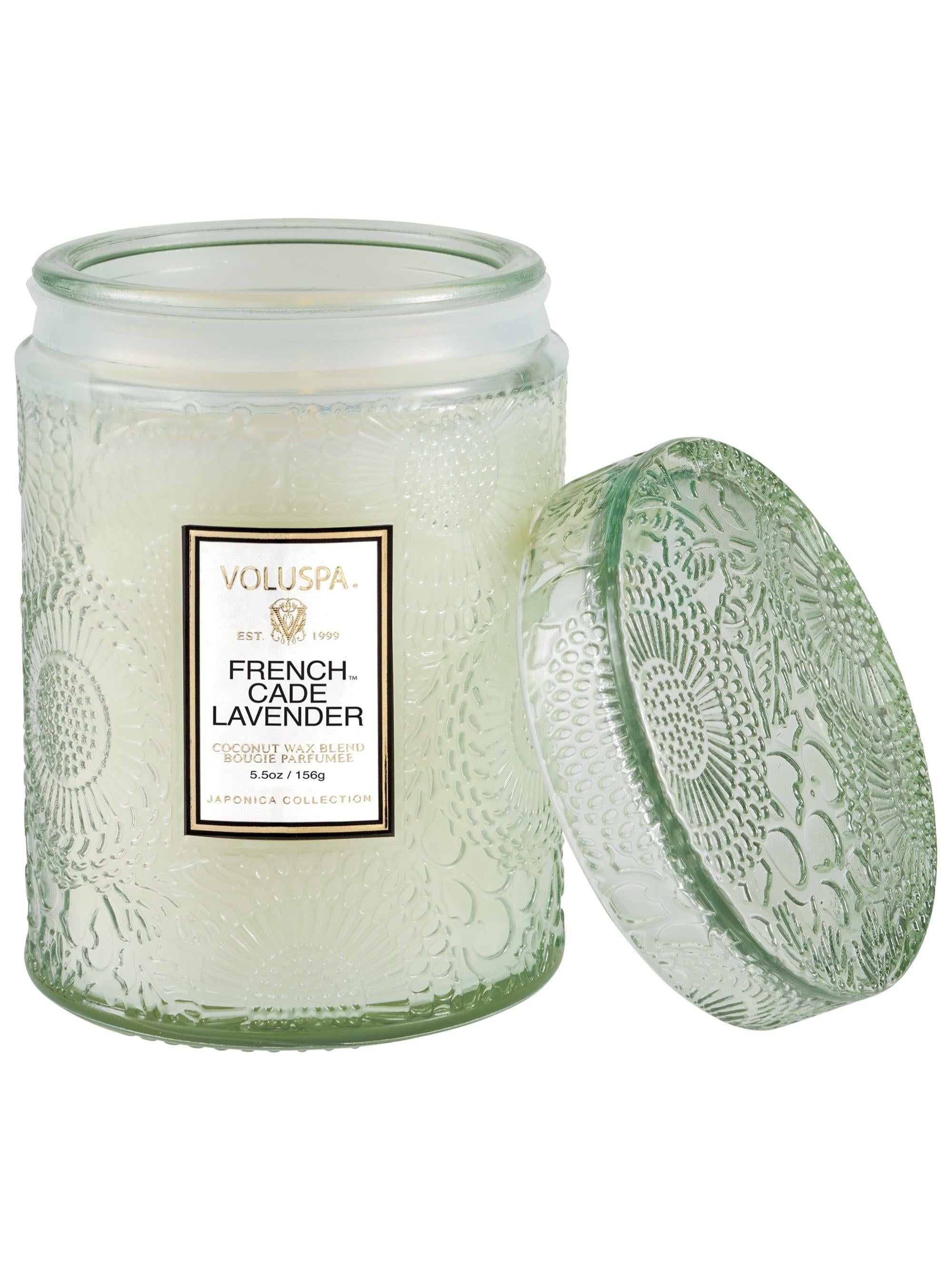 Voluspa French Cade Lavender Small Jar Candle, 5.5 oz, pale green embossed jar with the lid beside it