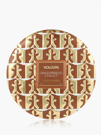 Voluspa Gingerbread Chalet 3-Wick Tin Candle, brown and cream patterned lid viewed from above