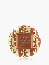 Voluspa Gingerbread Chalet Mini Tin Candle, brown and cream patterned lid viewed from above