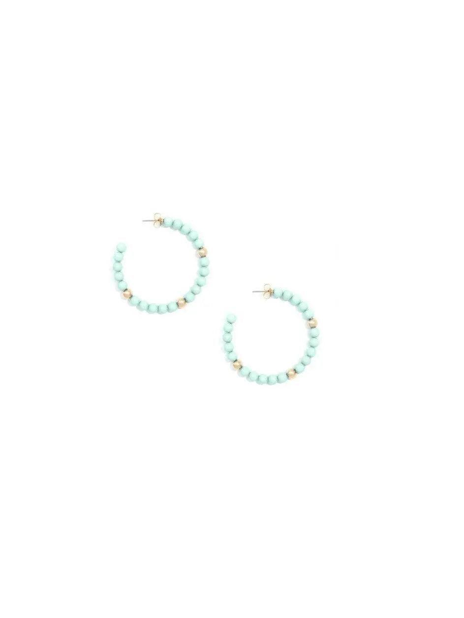 Beaded, c-shaped resin hoop earring with accents of gold-tone beads.